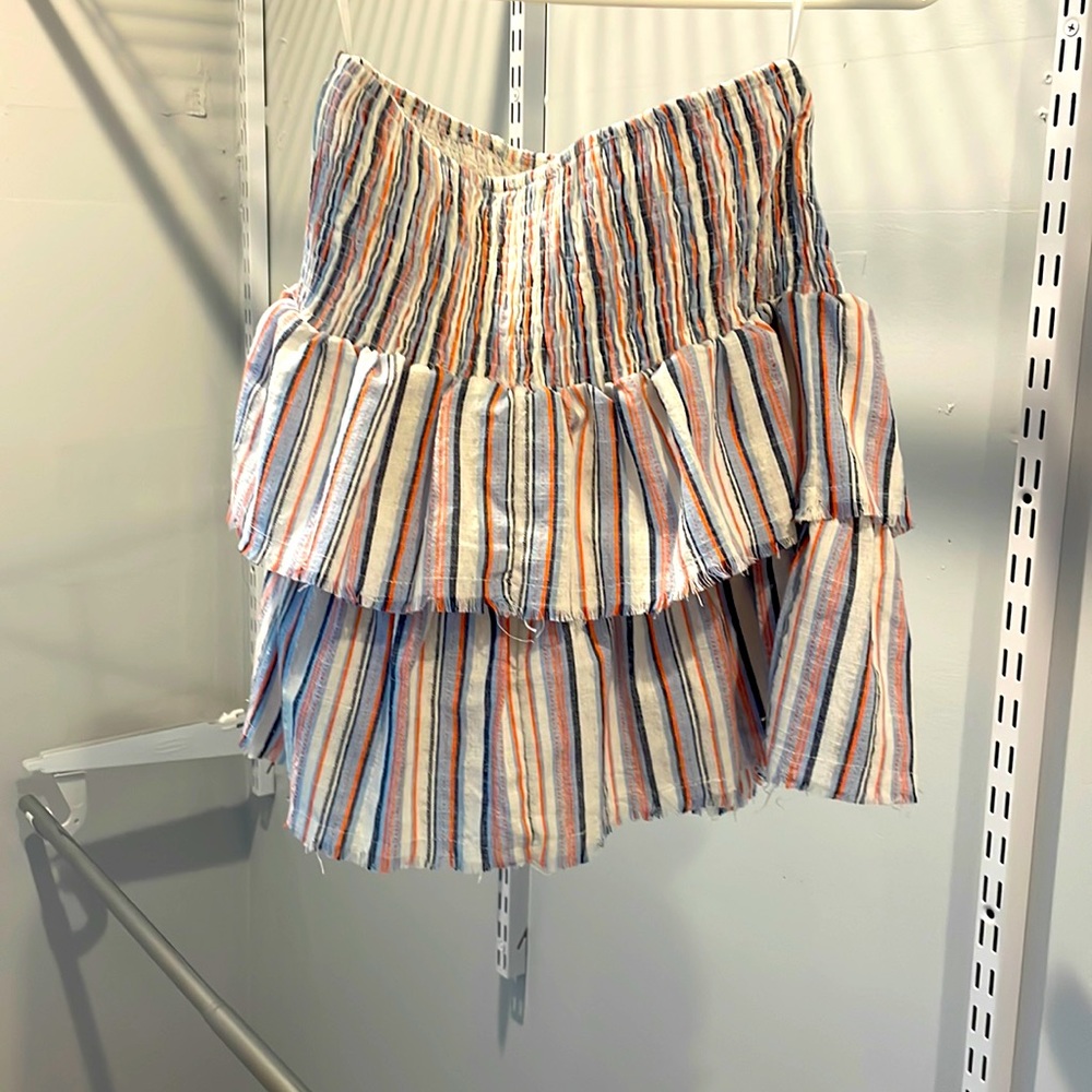 This colorful mini skirt from Shien is great. Size small but is stretchy.